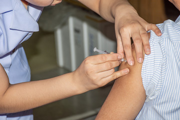 Patient asian woman get vaccinated the flu covid19