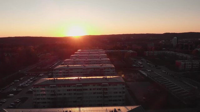 Sunlight reflecting from the roofs of the buildings.