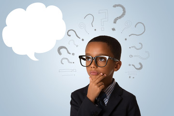 concept of confusion, inspiration and solution- pensive little african american boy in business suit and in glasses with empty speech bubble and many questions