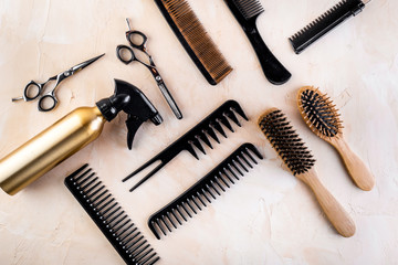 Hairdresser tools. Flat lay on beige background top view