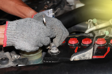 The skin repairman is fixing the car engine