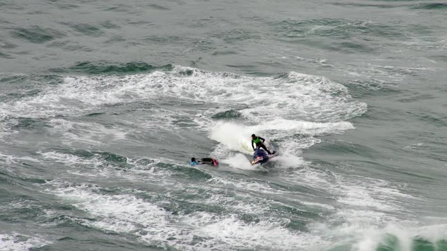 Watercraft rescues surfist in Nazar&egrave; in Portugal. High angle
