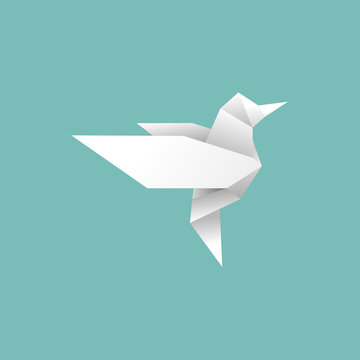 origami paper bird will fly to freedom on blue background.