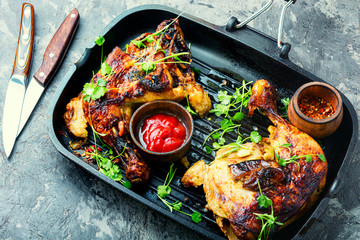 Grilled chicken leg on grill