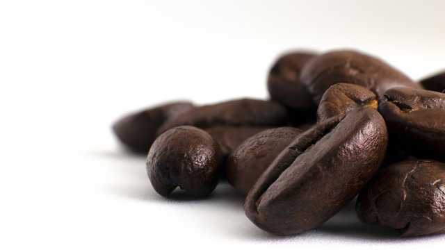 Coffee beans close up on a white background