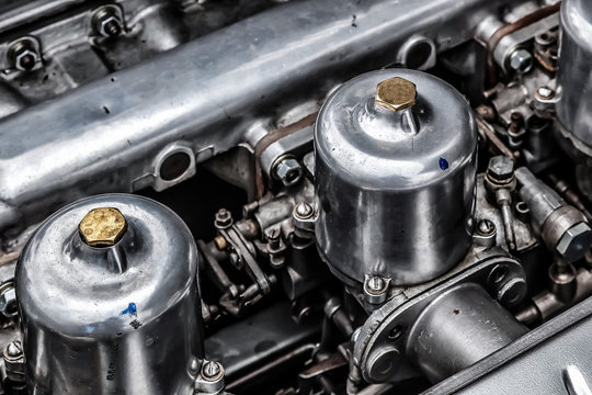 Carburettors under the Bonnet of an Old Jaguar Sports Car