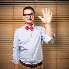Man wearing a red bow tie. Man wearing a red bow tie. Doing five number gesture.