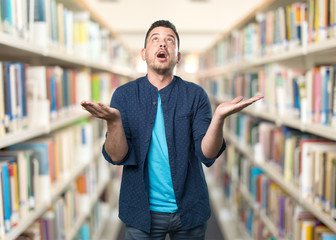 Young man wearing a blue outfit. Look praying.