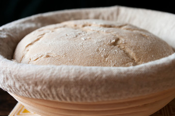 Bread sourdough dough in proofing basket ,before baking, whole wheat recipe. Rye flour. Home made.