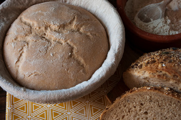 sourdough dough in proofing basket ,before baking, whole wheat recipe. Rye flour. Home made seed bread.