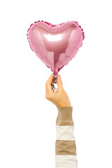 Pink air balloon held by a hand on an isolated background. Concept wedding, valentines day, photo...