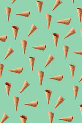 Floating waffle cones pattern for making sweet ice cream dessert.
