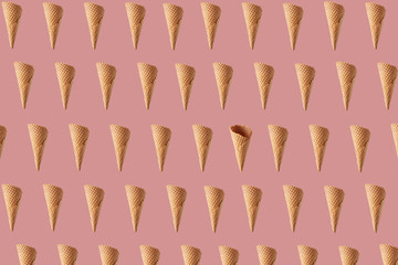 Horizontal pattern with flying waffle cones for ice cream or gelato.