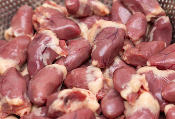 fresh chicken hearts as background