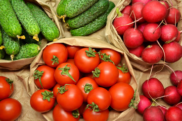 Fresh vegetables from farmers market. Cucumbers, tomatoes, radish. Pickle cucumbers. Organic vegetables. Salad ingredients.