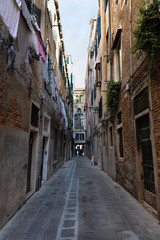 Fototapeta na wymiar Narrow non-touristy street in Venice.