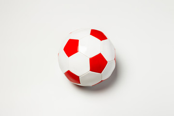 Fototapeta premium Soccer ball on a light background. Concept game for children, football, physical development. Flat lay, top view