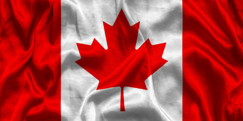 Canada national flag background with fabric texture. Flag of Canada waving in the wind.