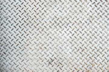 Old and rusted Metal diamond plate pattern texture, background
