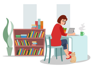 A young woman is working and studying from home