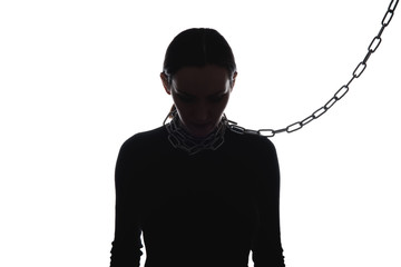 black and white image of woman's silhouette with chain around neck, domestic violence concept, harassment