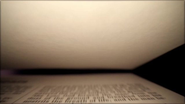 Pulling back through Genesis Chapter Two as the blank top page settles into position & the words on the bottom page start out being motion blurred, then normal as it travels down the page.