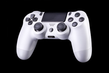 White video game joystick gamepad isolated on a black background