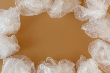 transparent disposable plastic bags on a brown background