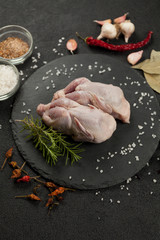 Raw quail meat on kitchen, cooking gourmet bird. Healthy diet recipe.