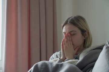 Portrait of ill woman at home.