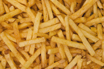Crisp french fries as background.