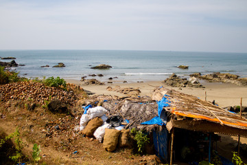 Fototapeta na wymiar Dirty beach, garbage bags on the beach in India