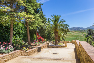 Obraz premium Flowers and steps in the gardens of Ronda, Spain
