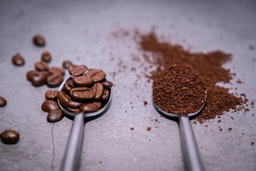 Coffee beans and spoon on vintage floor