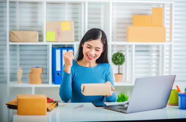 SME business owner girl freelance recieved order from customer happy success online marketing with packaging box and delivery service work from home.