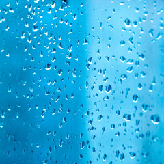 Blue water drops background. water drop background. Drops of water on glass.  Drops of water on a...