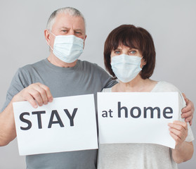 Couple of elderly people in medical masks in pandemic Coronavirus