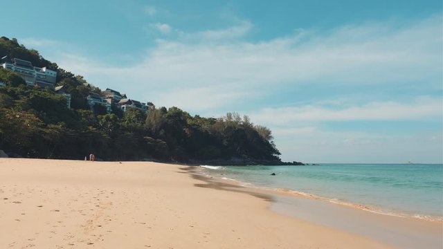 Thailand beach on a sunny day. Asian beach background. Popular tourist resort Nai Thon beach in Phuket. 