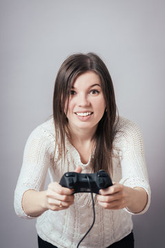 picture of happy woman with joystick playing video games