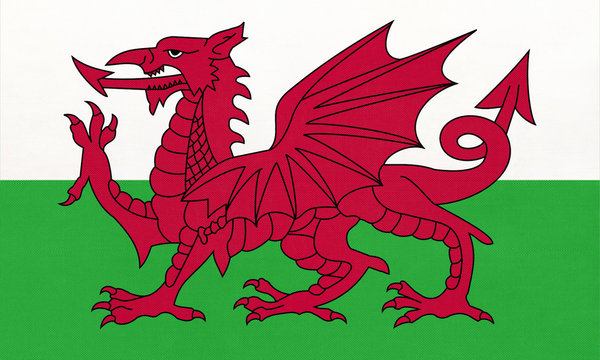 Wales national fabric flag, textile background. Symbol of part of United kingdom international world country.