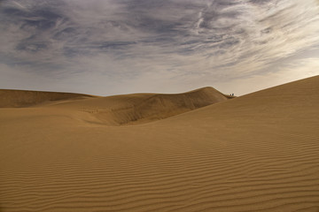summer desert landscape on a warm sunny day from Maspalomas dunes on the Spanish island of Gran...