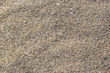 Sea sand nature texture in summer sun as background