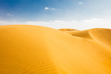 Moroccan desert landscape with blue sky. Dunes background.