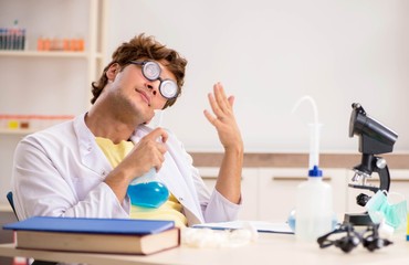 Funny crazy chemist doing experiments and tests