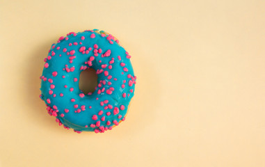 donuts with blue glaze on a yellow background