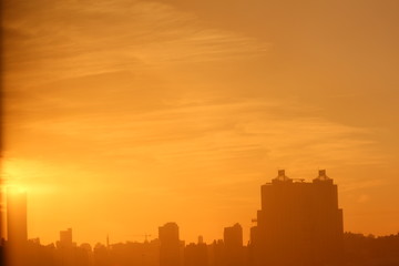 Early Morning Urban Scene With A Warm Orange Sunrise