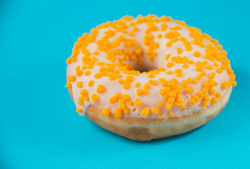 donuts with, white-yellow glaze, on a blue background, sweet dessert festive