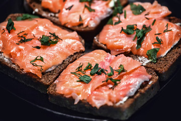 Sandwich with salmon and herbs
