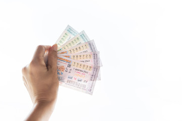 Bangkok THAILAND, 28/04/2020 : A hand female holding Thai government lotteries on white background.