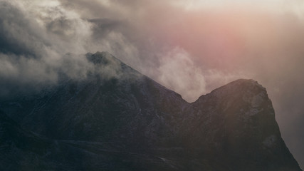 Sunset and clouds over mountains